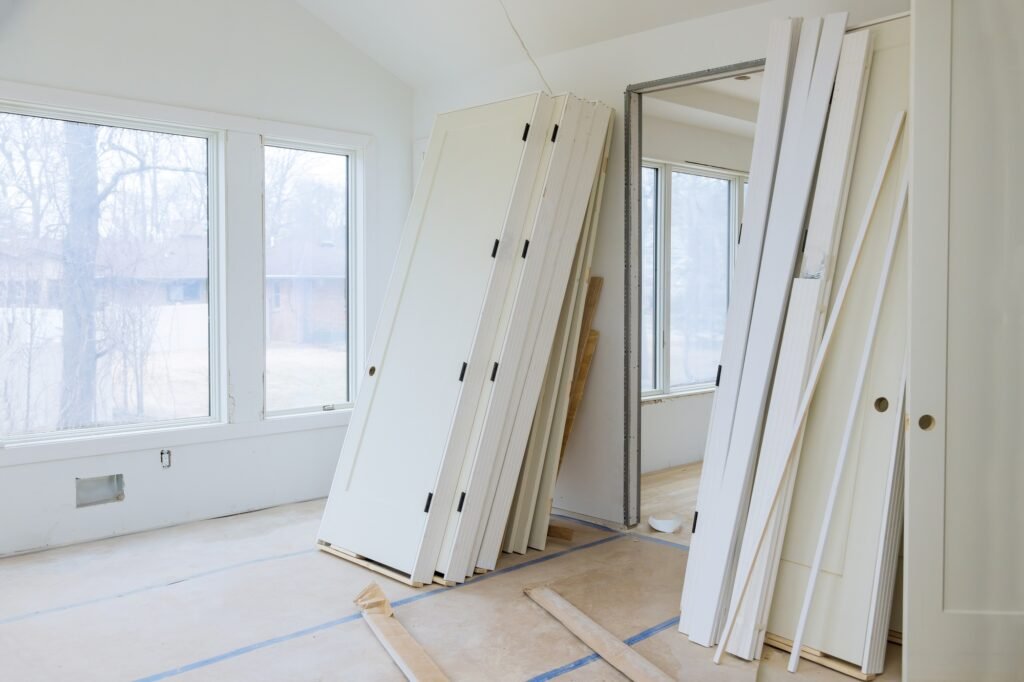 Interior wooden stacker door installation apartment building, wait installation for preparation of